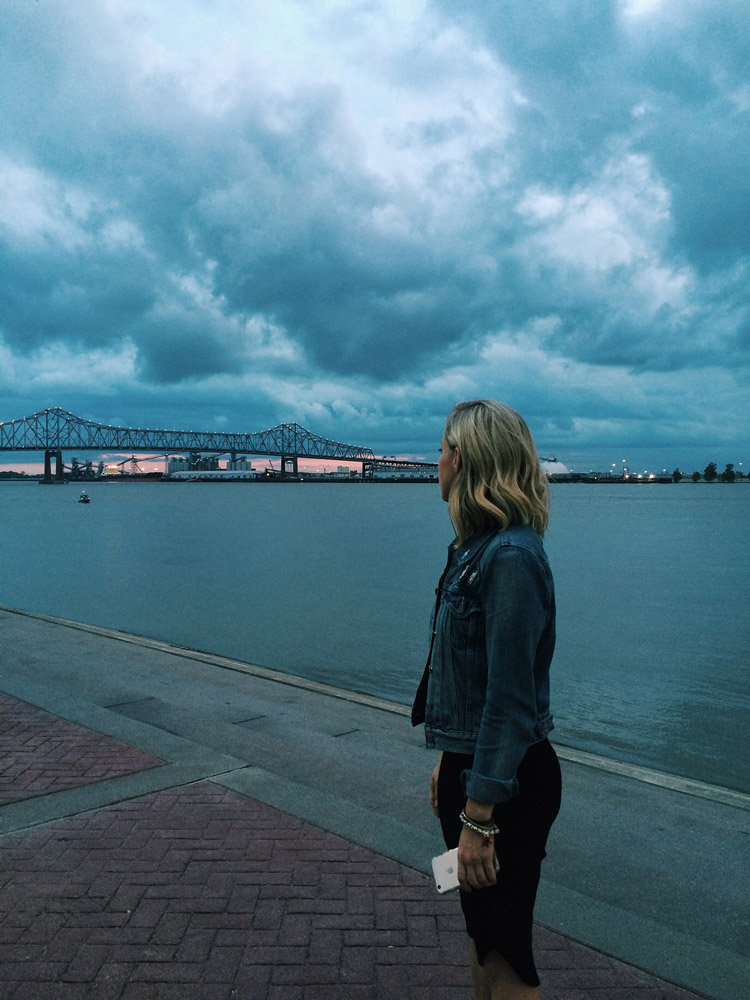 Jen Hood standing at the Mississippi River Baton Rouge