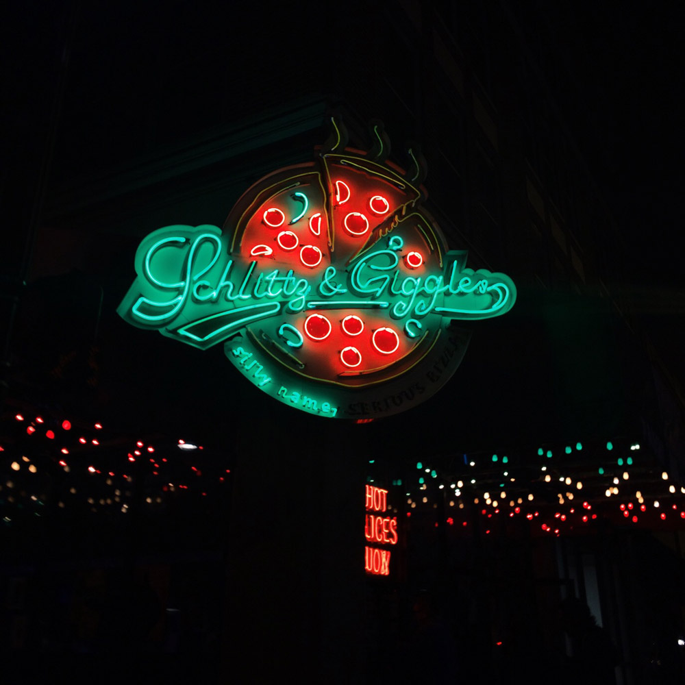 Schlitz & Giggles neon pizza sign