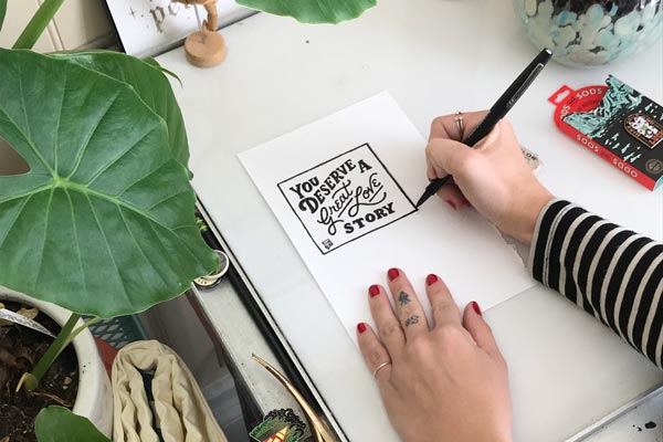 Amy Hood Sketching the You Deserve A Great Love Story Campaign graphic