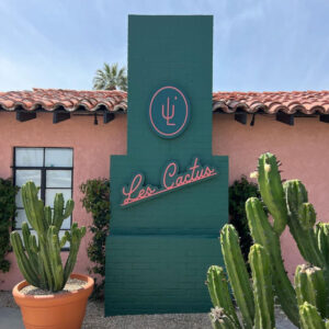 Les Cactus Hotel view of the chimney with the logo on it and cactuses