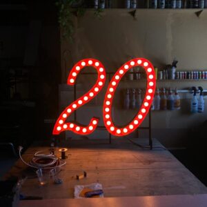 20 sign for Deluxe Bakery by Radtron Studios