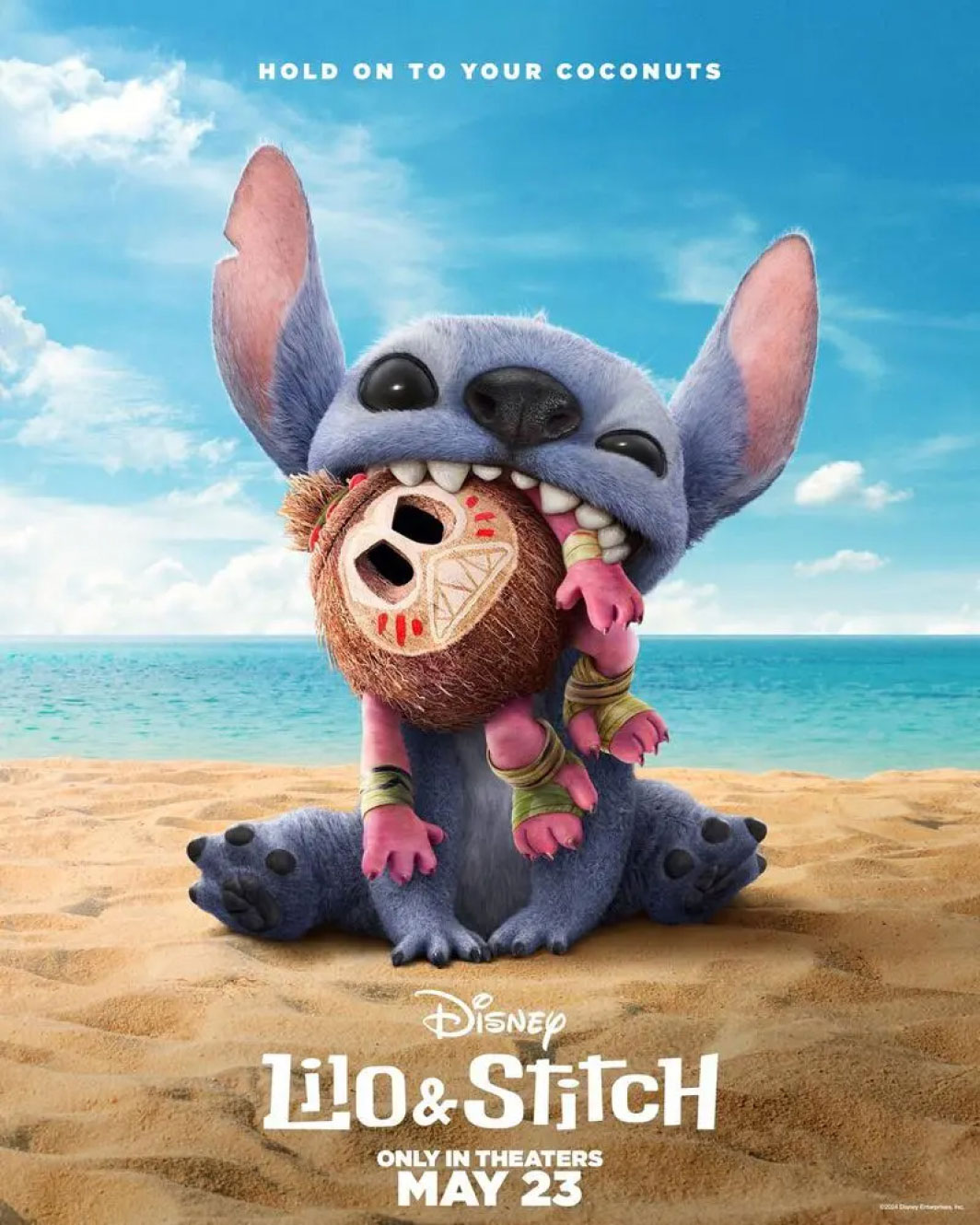 Stitch on the beach with a coconut in his mouth
